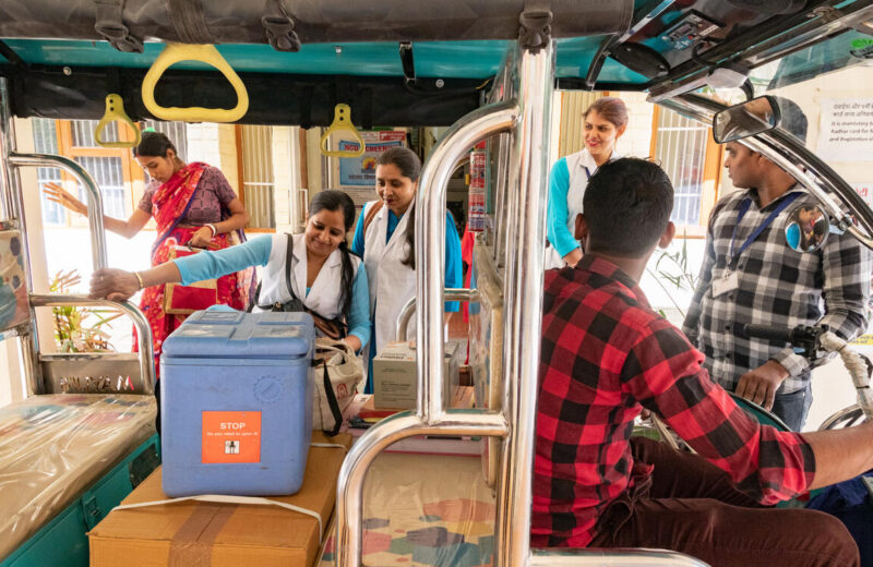 Health workers loading a mobile clinic
